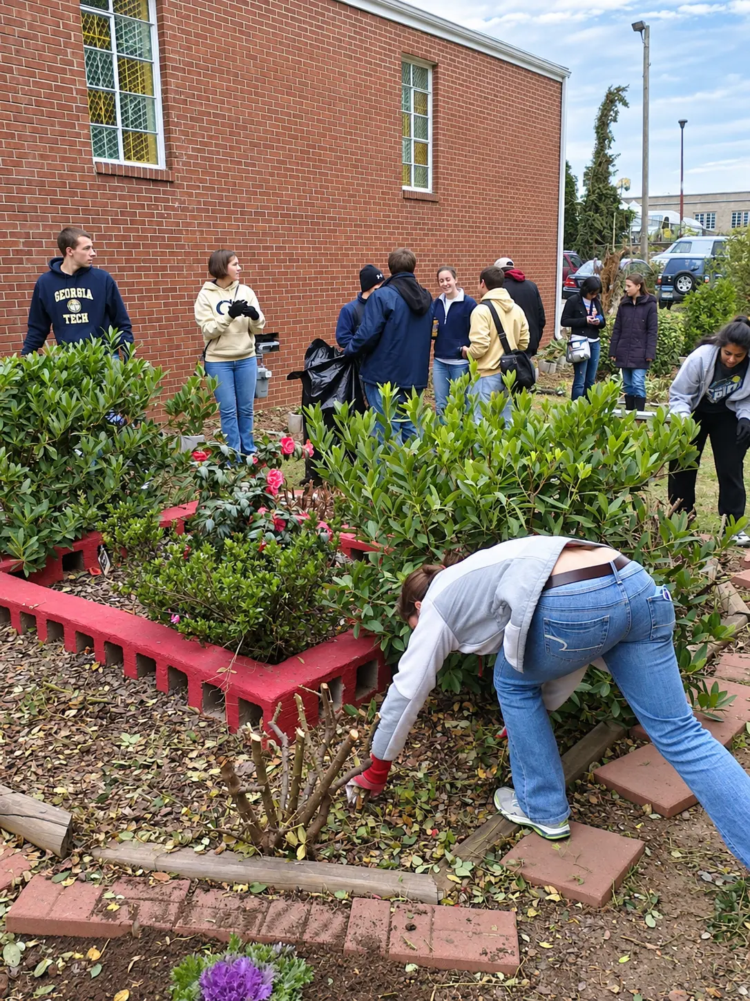 Volunteers working together in a community garden cleanup